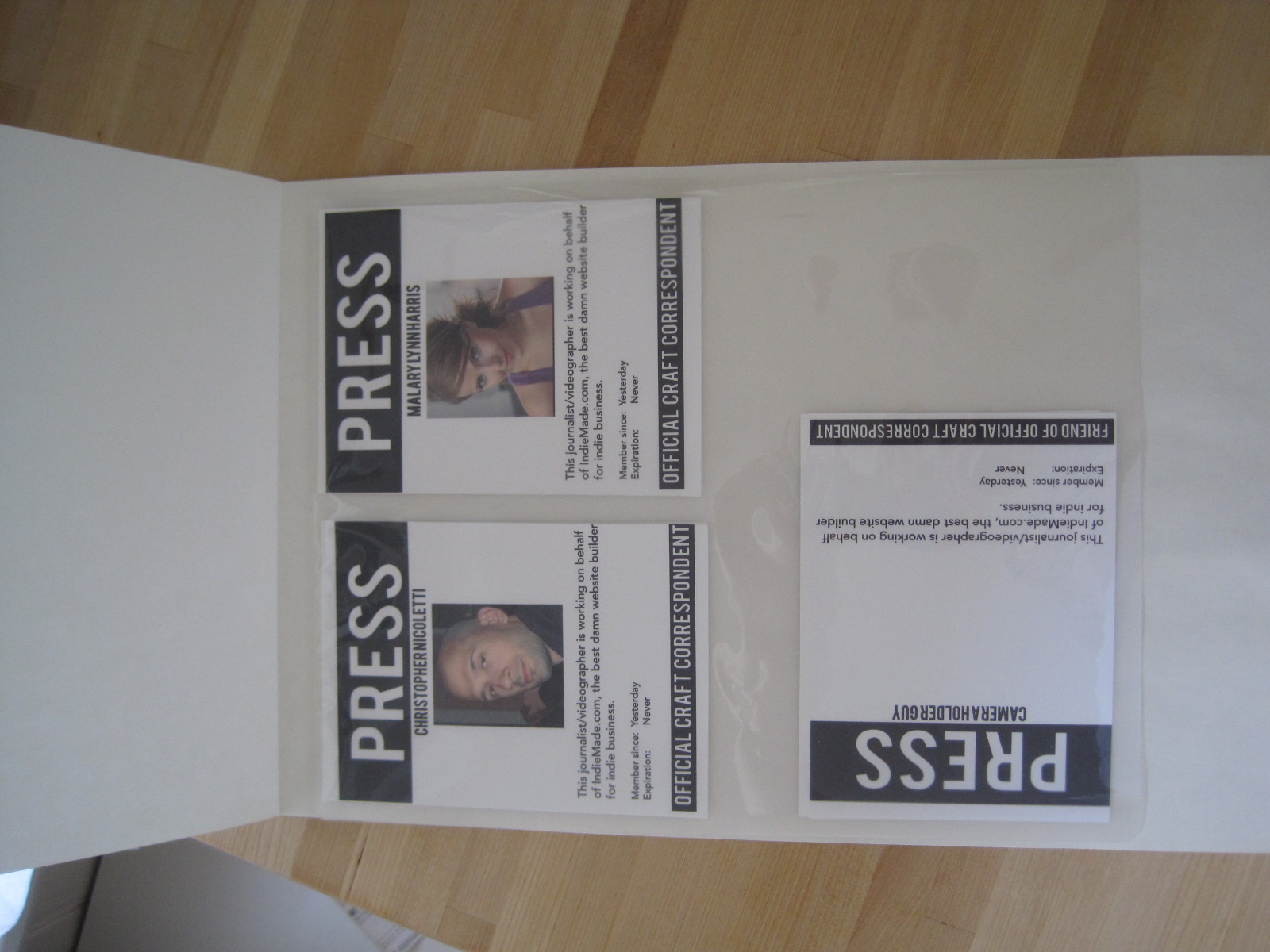 Places badges in a lamination pouch